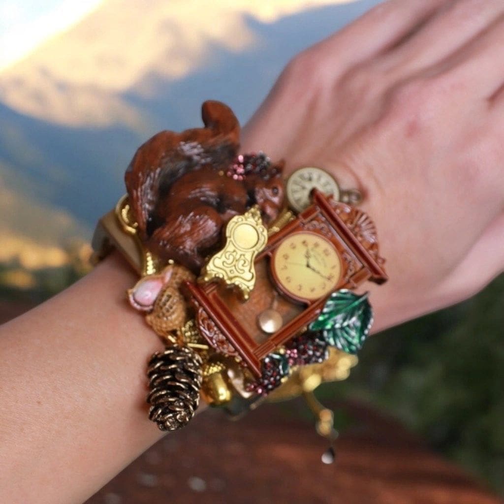A woman 's wrist with many different items on it.