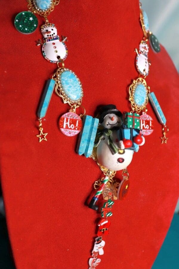 A necklace with many different colored beads and some kind of face