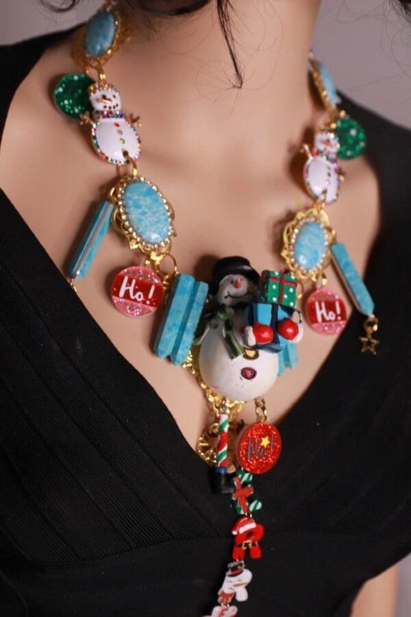 A woman wearing a necklace with many different colored beads.