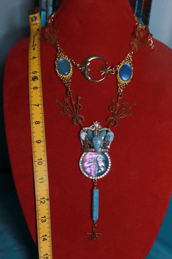 A red display with a blue necklace and ruler