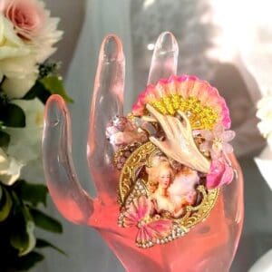 A hand with some flowers on it
