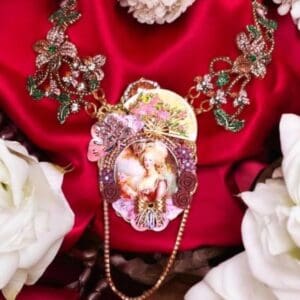 A necklace with a picture of a woman on it.