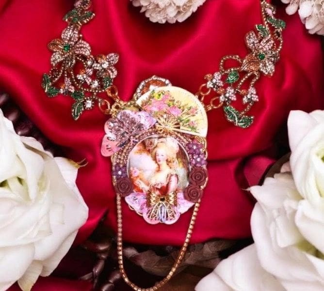A necklace with a picture of a woman on it.