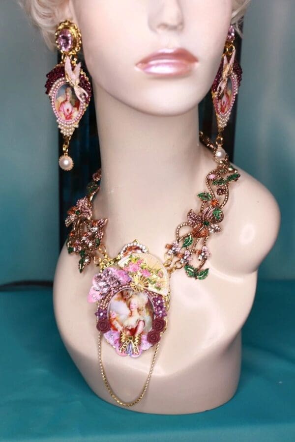 A mannequin wearing jewelry and earrings.