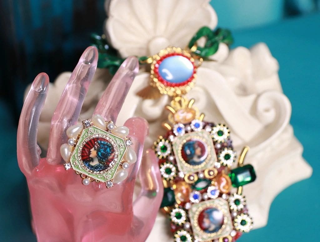 A close up of three different jewelry items
