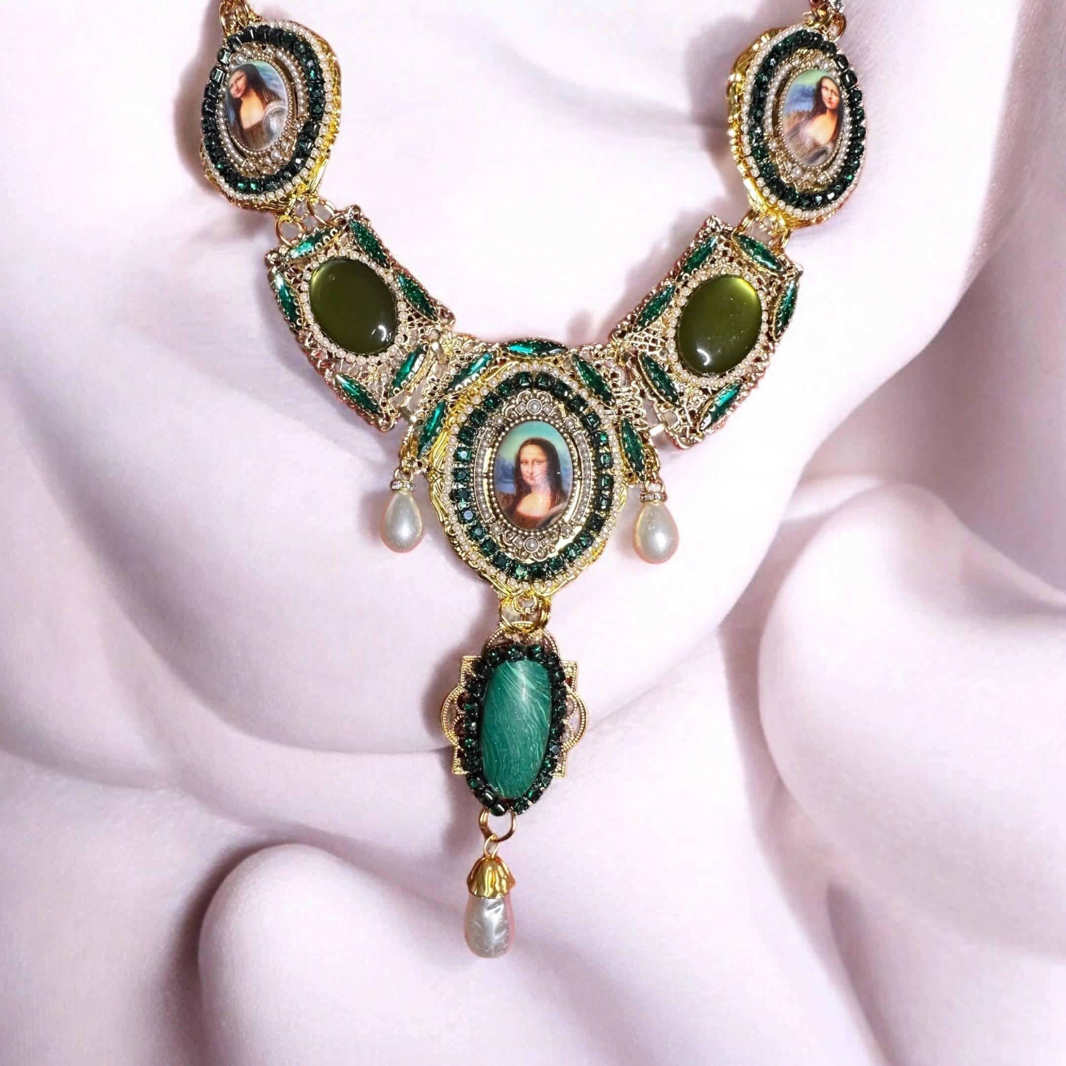 A necklace with green stones and gold accents.