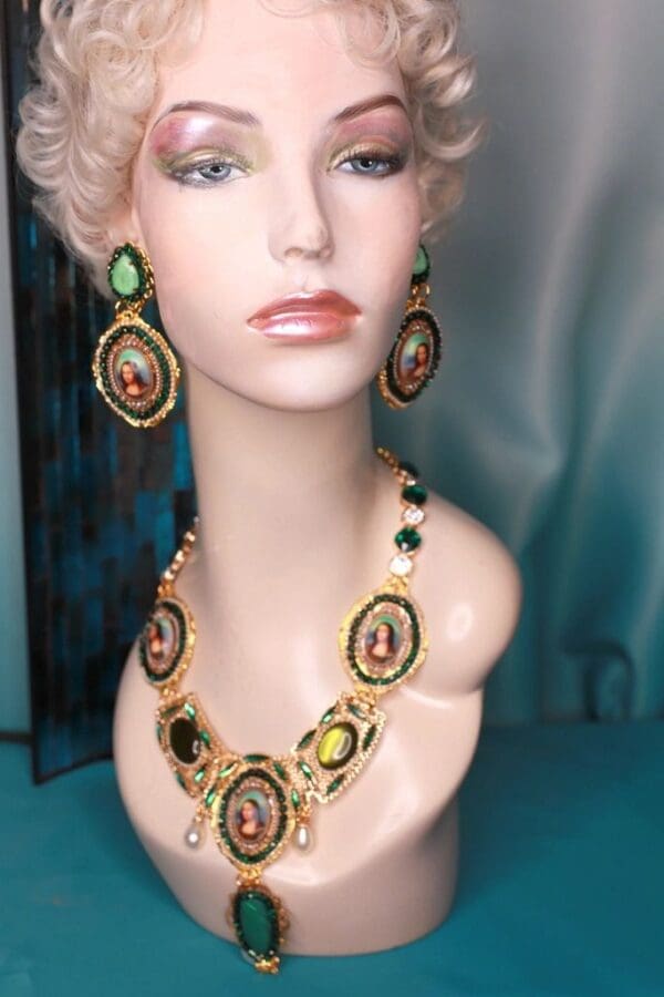 A mannequin wearing jewelry and earrings.