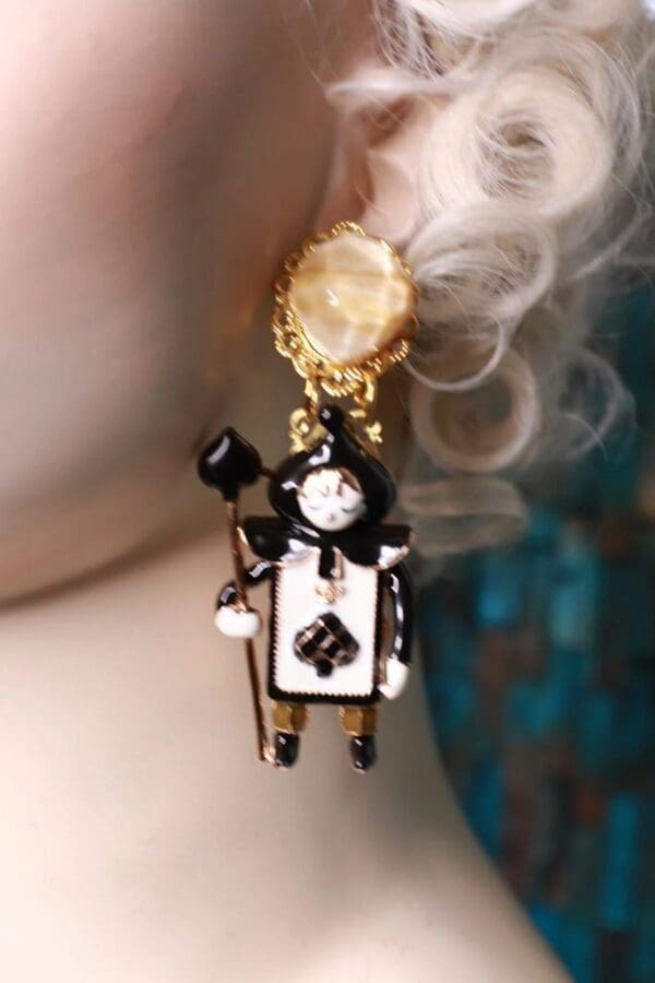 A close up of a person wearing earrings