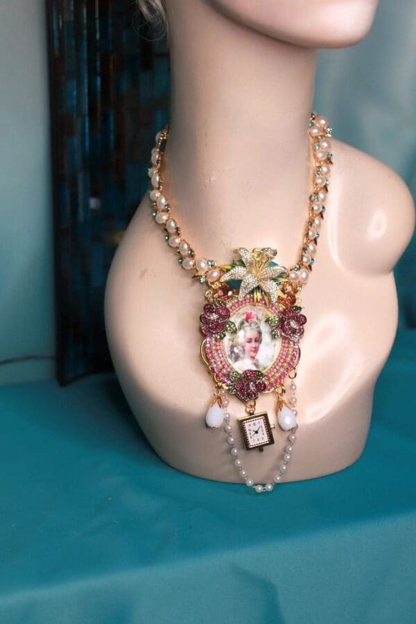 A necklace with a picture of a woman on it.