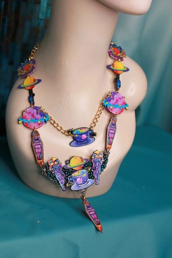 A necklace that is sitting on top of a mannequin.