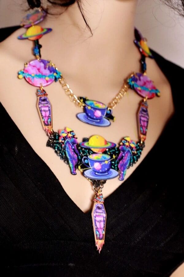 A woman wearing a necklace with many colorful beads.