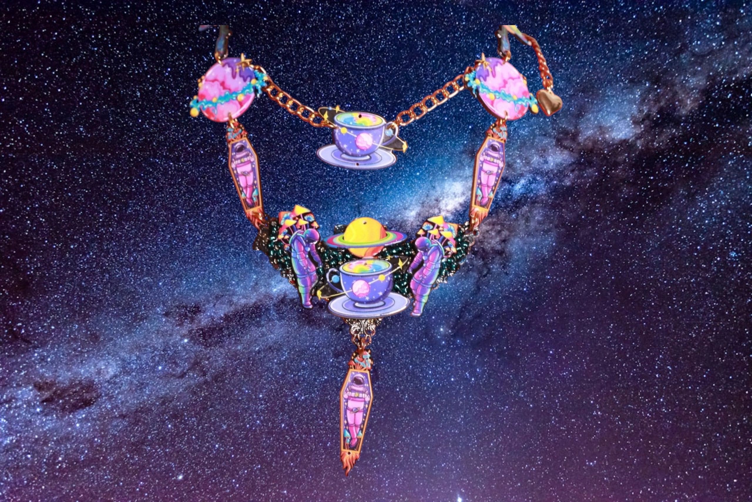 A colorful necklace with a space background