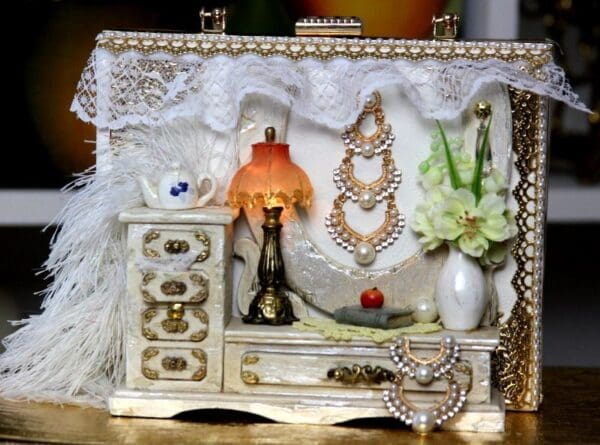 A white box with some jewelry on it