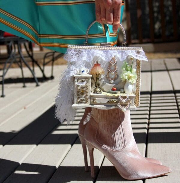 A person holding onto a bag with a shoe on it