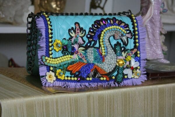 A purse with beads and sequins on it
