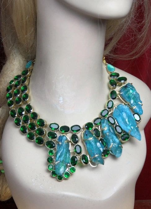 A necklace with green stones and blue glass