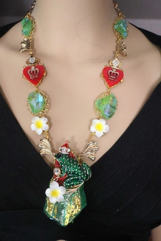 A woman wearing a necklace with flowers and leaves.