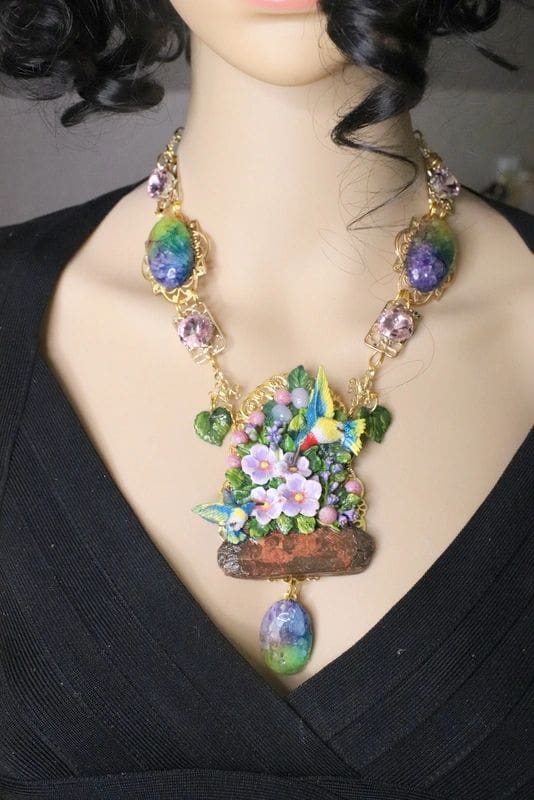 A woman wearing a necklace with flowers in it.
