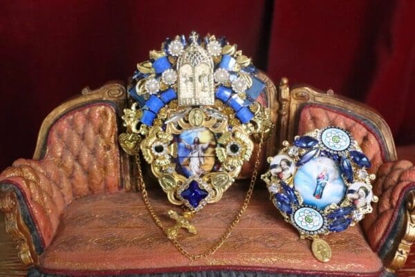 A close up of two ornate pieces of jewelry