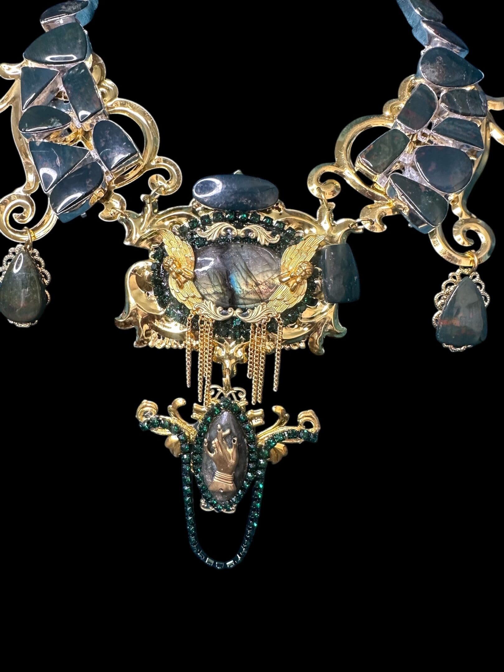 A close up of the chandelier with blue glass