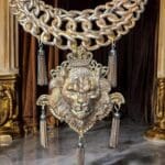 A large chain with tassels hanging from it.