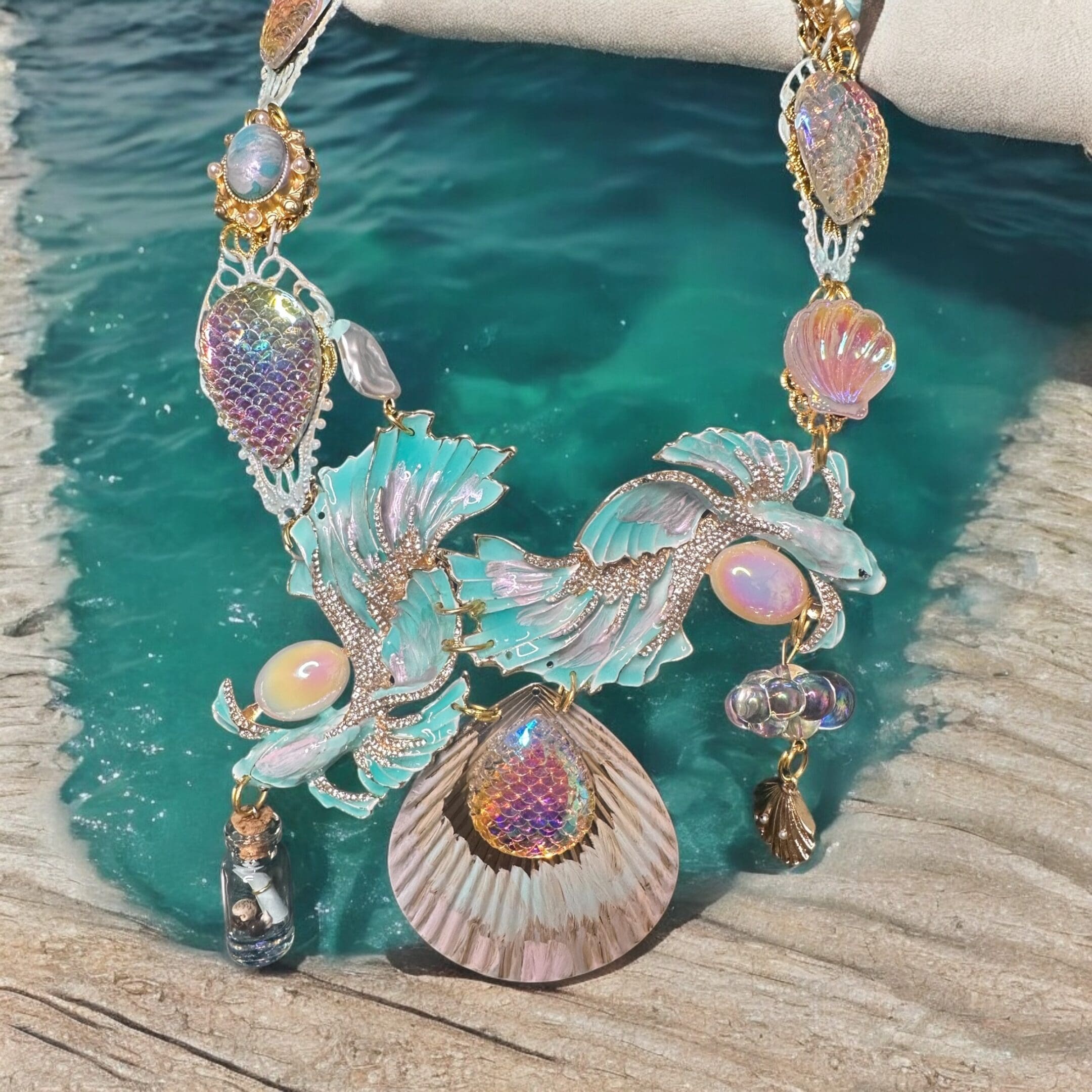 A necklace that is sitting on the ground.