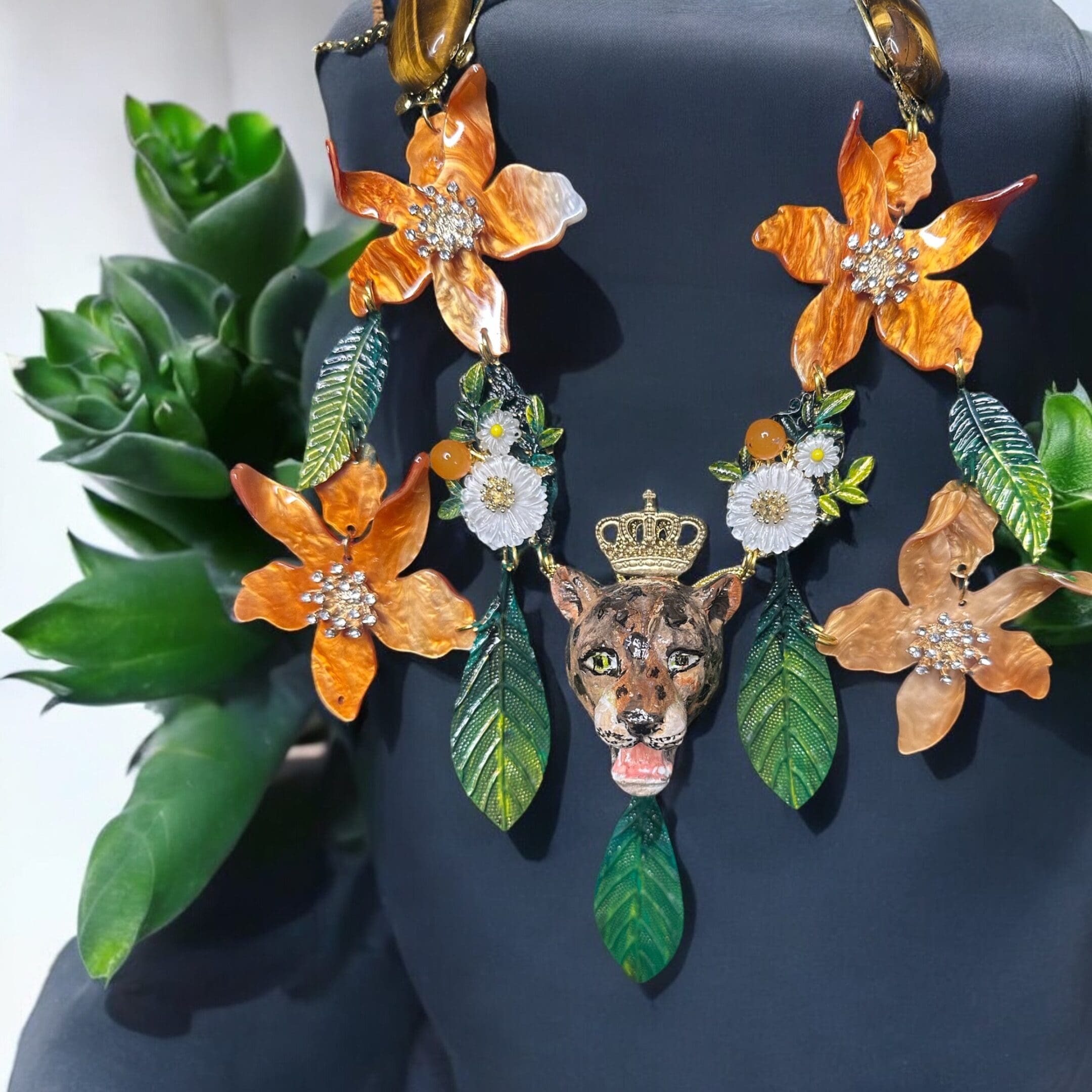 A necklace with flowers and leaves on it