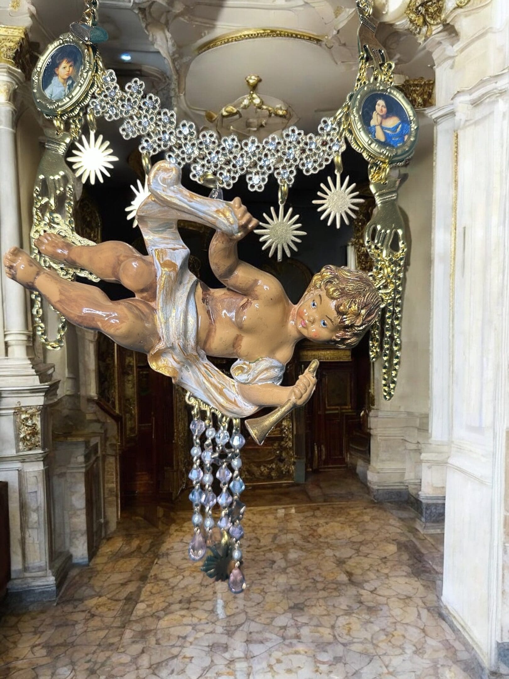 A statue of a man in chains hanging from the ceiling.