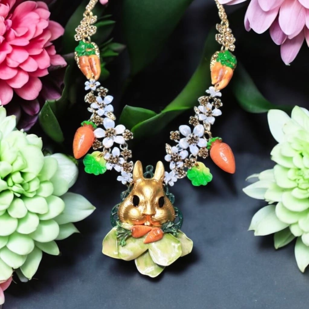 A necklace with carrots and flowers on it
