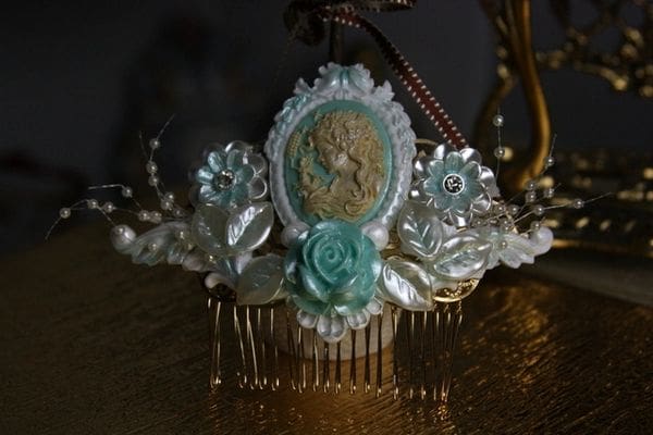 A decorative comb with a picture of a woman.