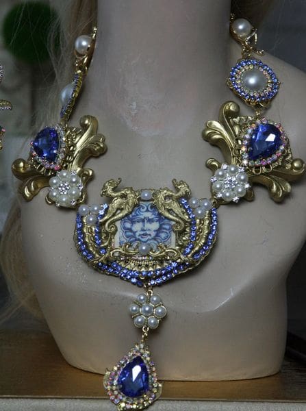 A necklace with blue and white stones on it
