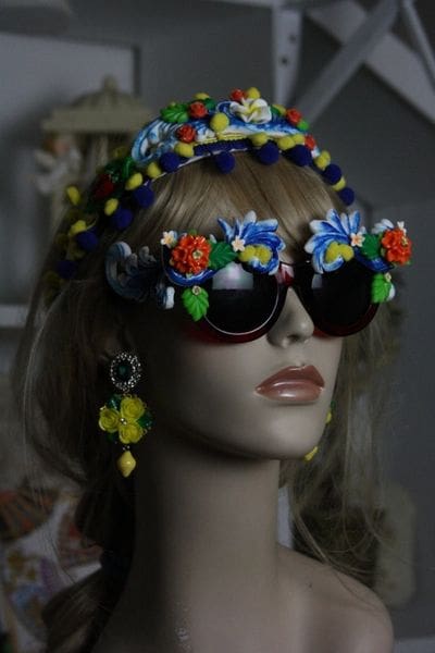 A mannequin wearing sunglasses and a hat.