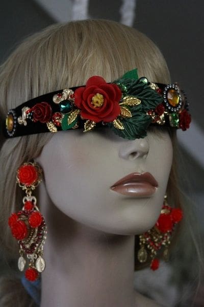 A woman wearing a headband and earrings.