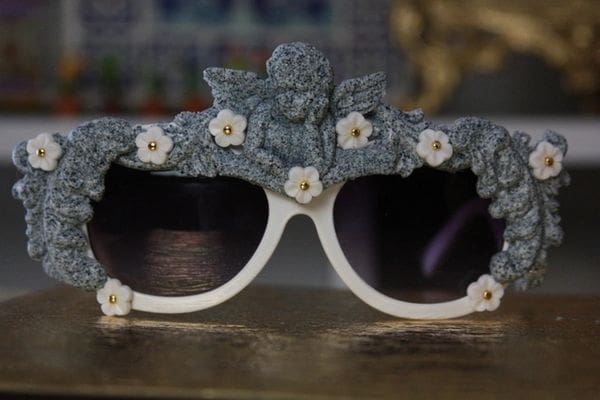 A pair of sunglasses with flowers on them.