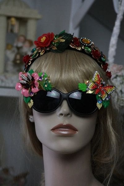 A mannequin wearing sunglasses and a headband.