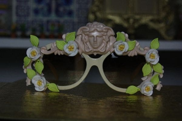 A pair of glasses with flowers on top