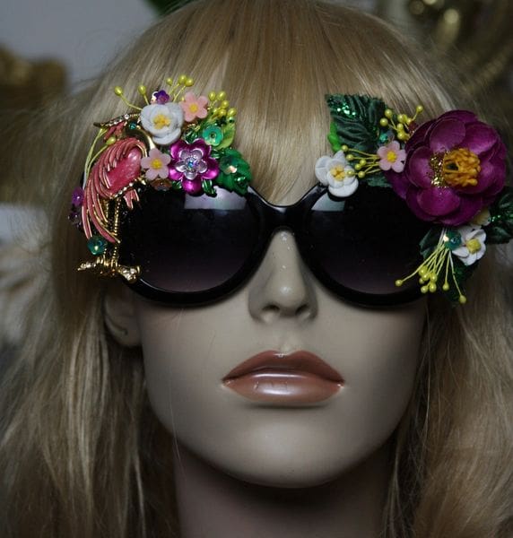 A mannequin wearing sunglasses with flowers on them.