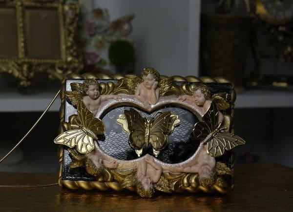 A picture frame with two butterflies on it.