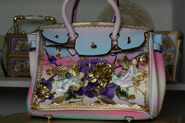 A close up of the front of a purse