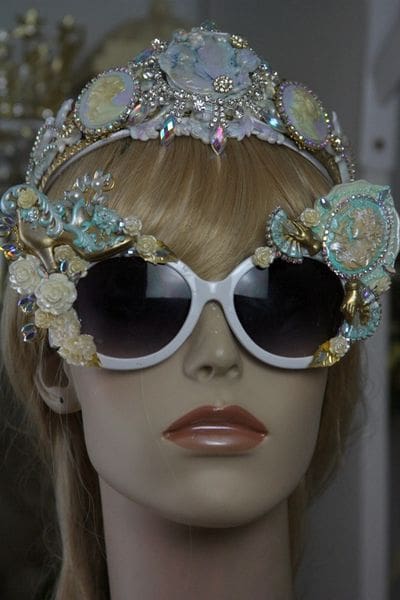 A mannequin wearing sunglasses and a tiara.