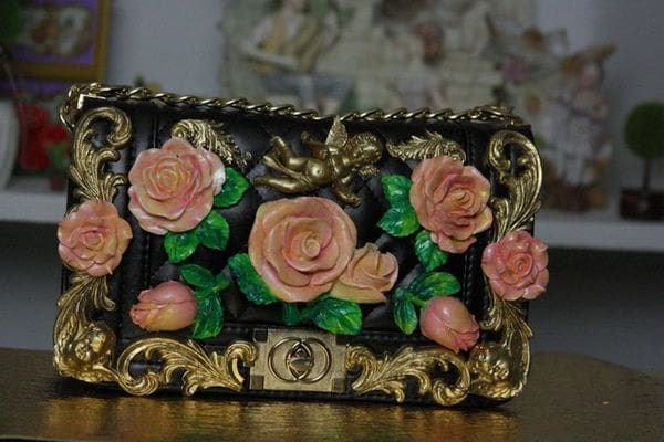 A picture of a purse with roses on it.