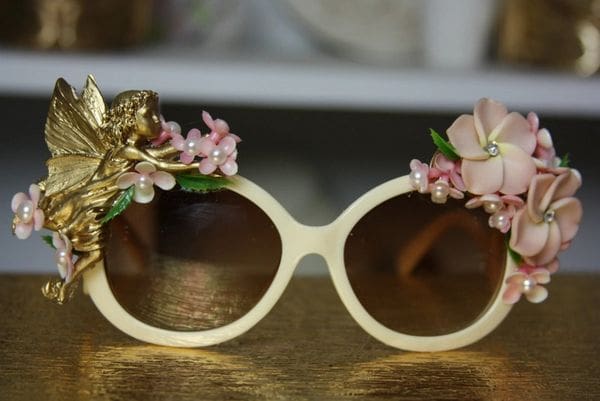 A pair of sunglasses with flowers on them.