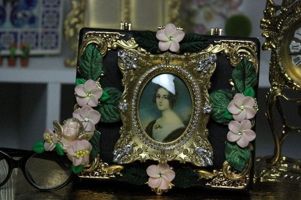 A picture of a woman in a frame with flowers around it.
