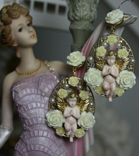 A statue of a woman wearing a dress and earrings.