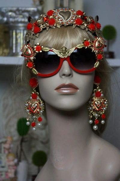 A mannequin wearing sunglasses and jewelry.