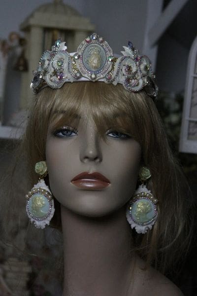 A mannequin wearing a tiara and earrings.