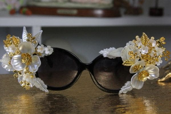 A pair of sunglasses with flowers on them.