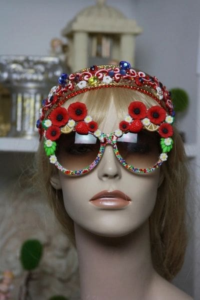 A mannequin wearing sunglasses with flowers on them.