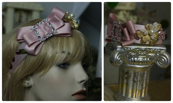 A close up of a mannequin head wearing a pink bow