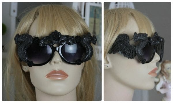 A mannequin wearing sunglasses with black frames.